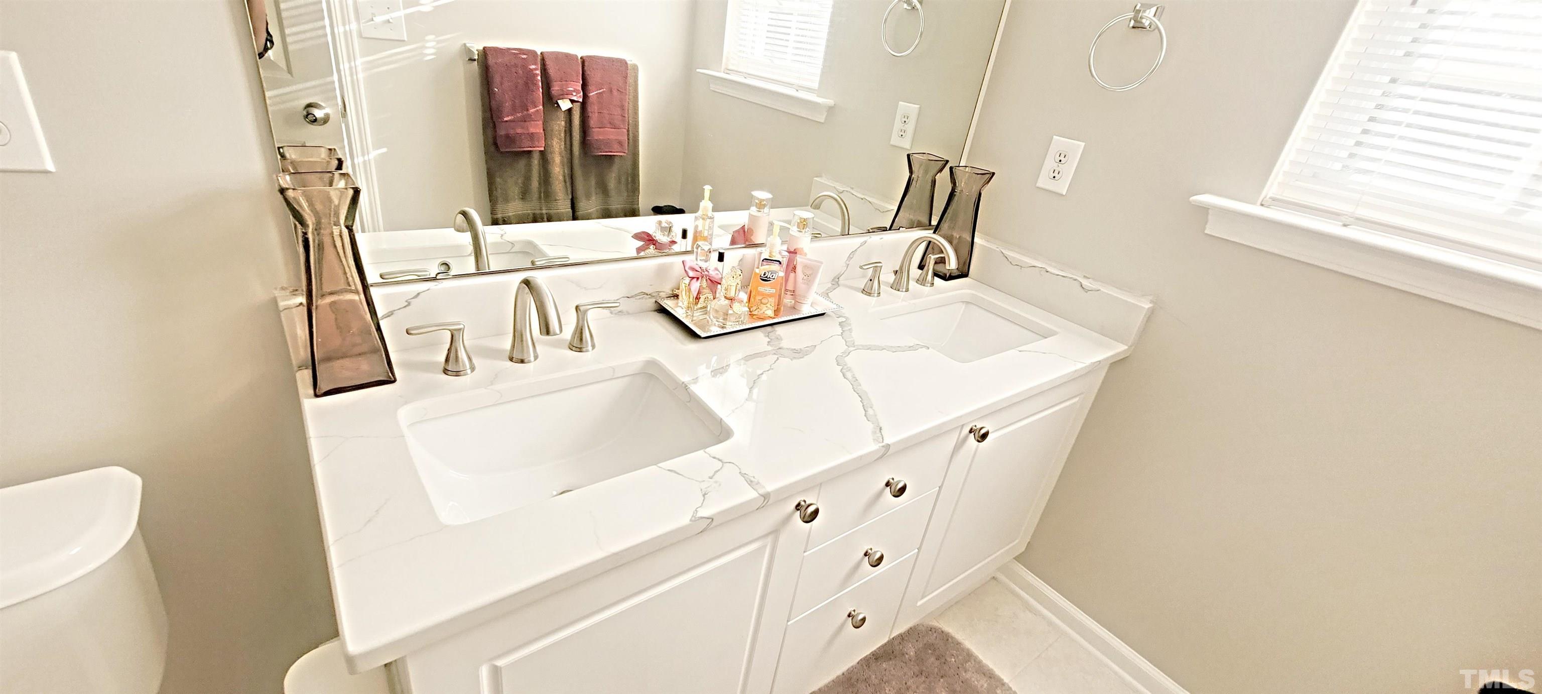 2109 Persimmon Ridge Drive Raleigh, NC 27604 - Photo 10 of 15 a bathroom with a sink and a mirror
