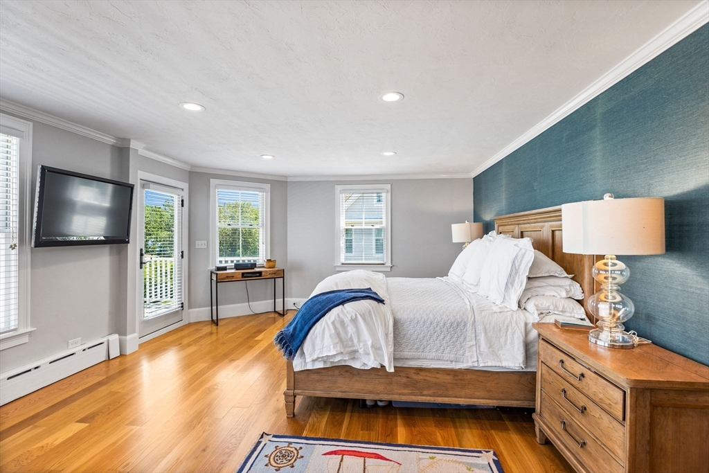 15 Sheldon Road Cohasset, MA 02025 - Photo 25 of 41 a bedroom with a bed and a flat screen tv