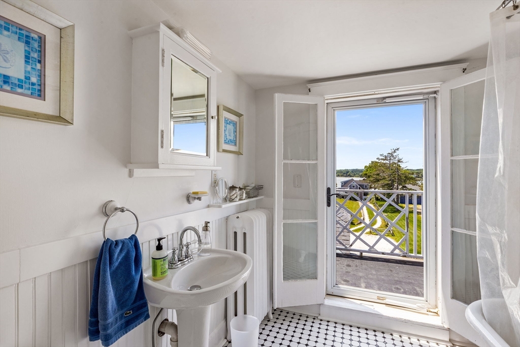 15 Sheldon Road Cohasset, MA 02025 - Photo 36 of 41 a bathroom with a granite countertop sink a toilet and a shower