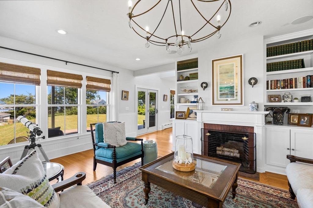 15 Sheldon Road Cohasset, MA 02025 - Photo 6 of 41 a living room with furniture and a fireplace