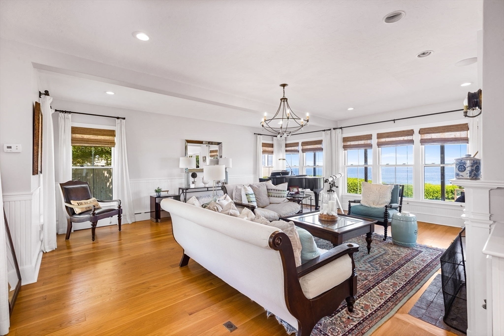 15 Sheldon Road Cohasset, MA 02025 - Photo 8 of 41 a living room with furniture and a chandelier