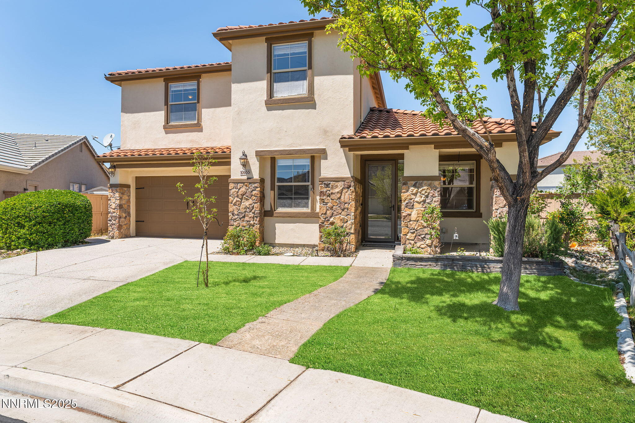 10655 Birch Point Court Reno, NV 89521 - Photo 1 of 19 front view of a house with a yard