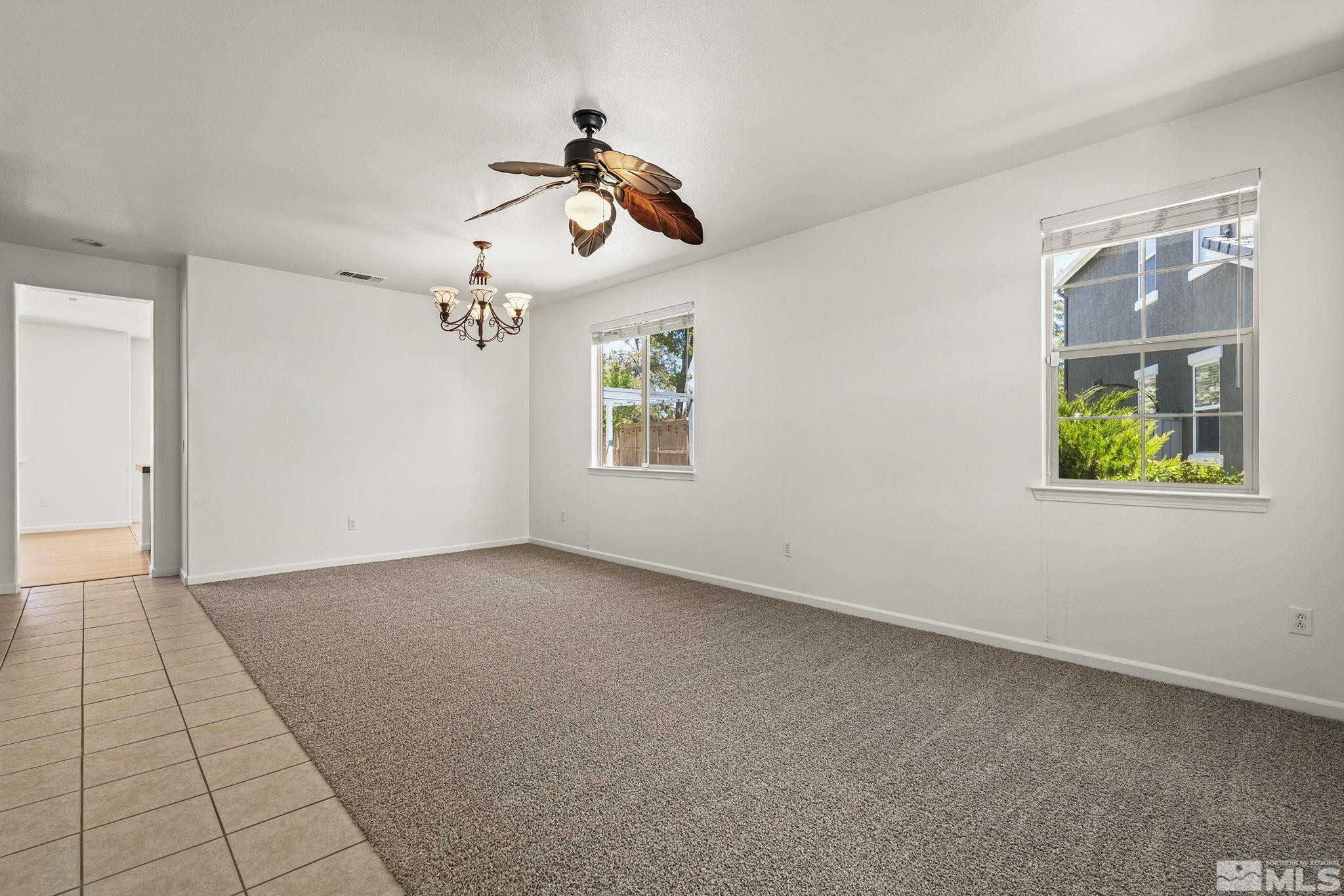 10655 Birch Point Court Reno, NV 89521 - Photo 5 of 19 an empty room with windows and fan
