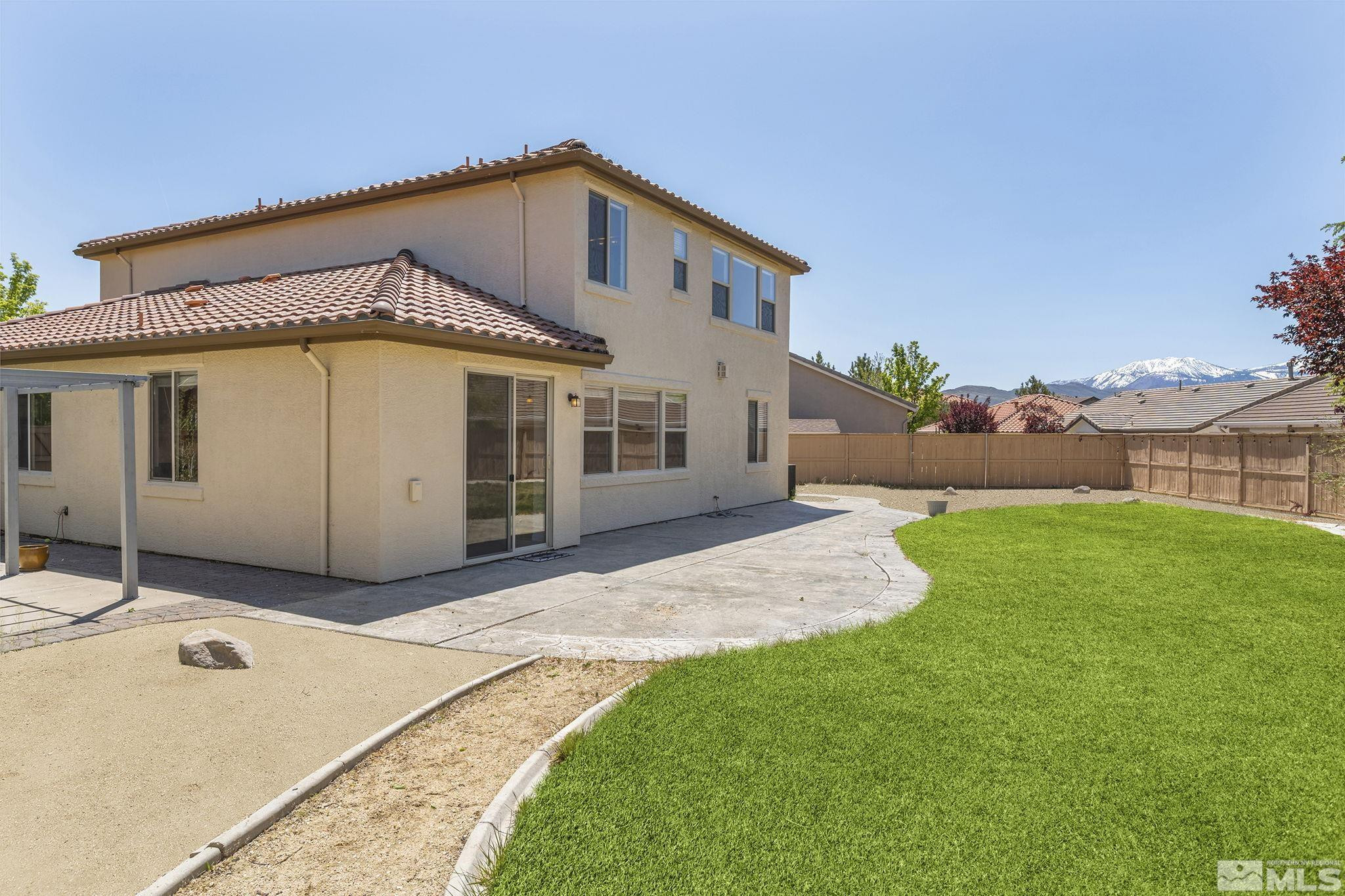 10655 Birch Point Court Reno, NV 89521 - Photo 6 of 19 a front view of a house with a garden
