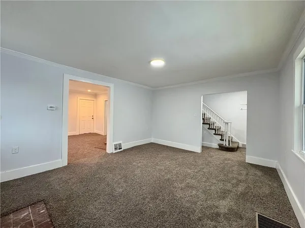 an empty room with a empty space and window