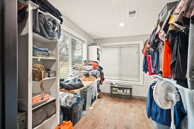 a kitchen with stainless steel appliances a refrigerator and a stove top oven