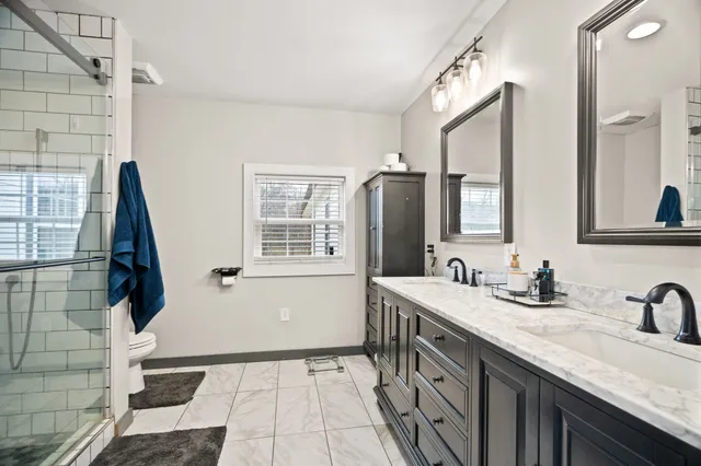 a kitchen with stainless steel appliances a stove sink and microwave
