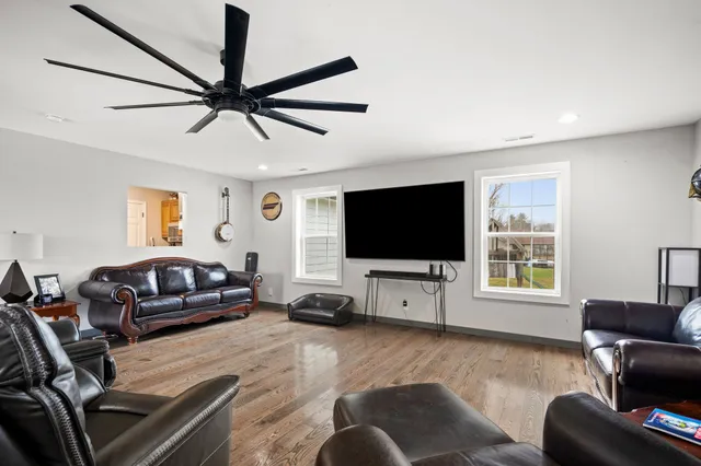 a bedroom with furniture and a window