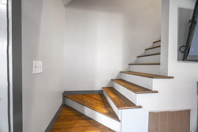 a view of a lake with couches chairs