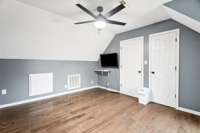 a view of a yard with table and chairs under an umbrella