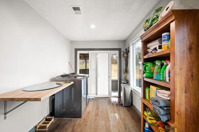 a view of a livingroom with furniture and a flat screen tv