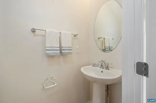 a bathroom with a sink and mirror