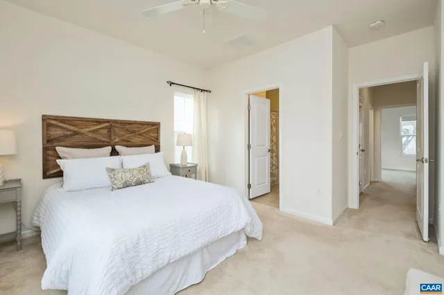 a bedroom with a bed and a lamp