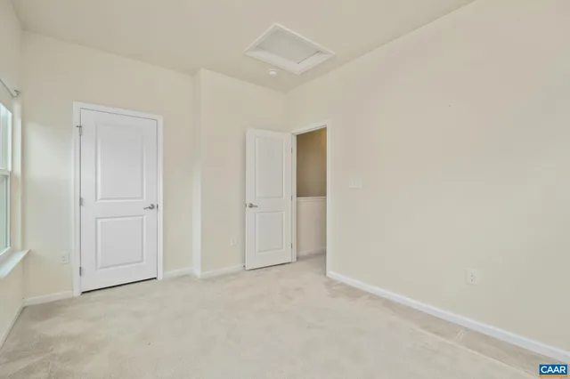an empty room with closet area