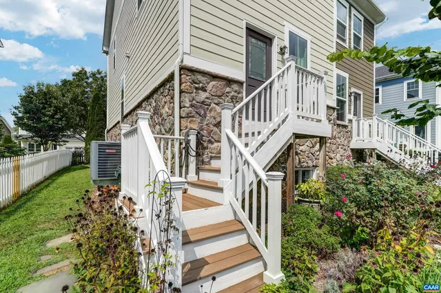 a view of street along with deck and outdoor seating