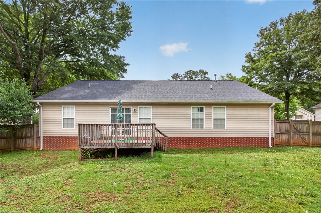 207 Hunters Lane Anderson, SC 29625 - Photo 6 of 46 Fully fenced in backyard, privacy fence wraps around the back area.