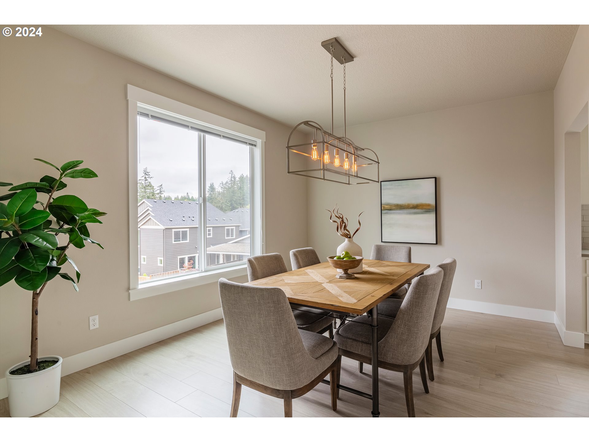 17683 Southwest Cobb Lane Beaverton, OR 97007 - Photo 14 of 27 a view of a dining room with furniture window and wooden floor
