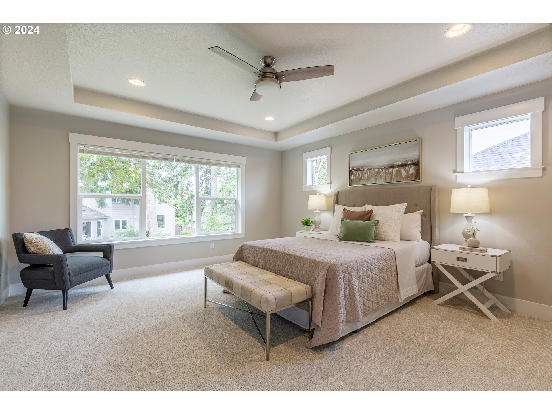17683 Southwest Cobb Lane Beaverton, OR 97007 - Photo 16 of 27 a spacious bedroom with a bed and a couch