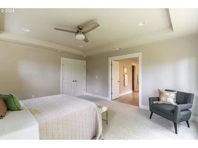 a bedroom with a bed and a couch