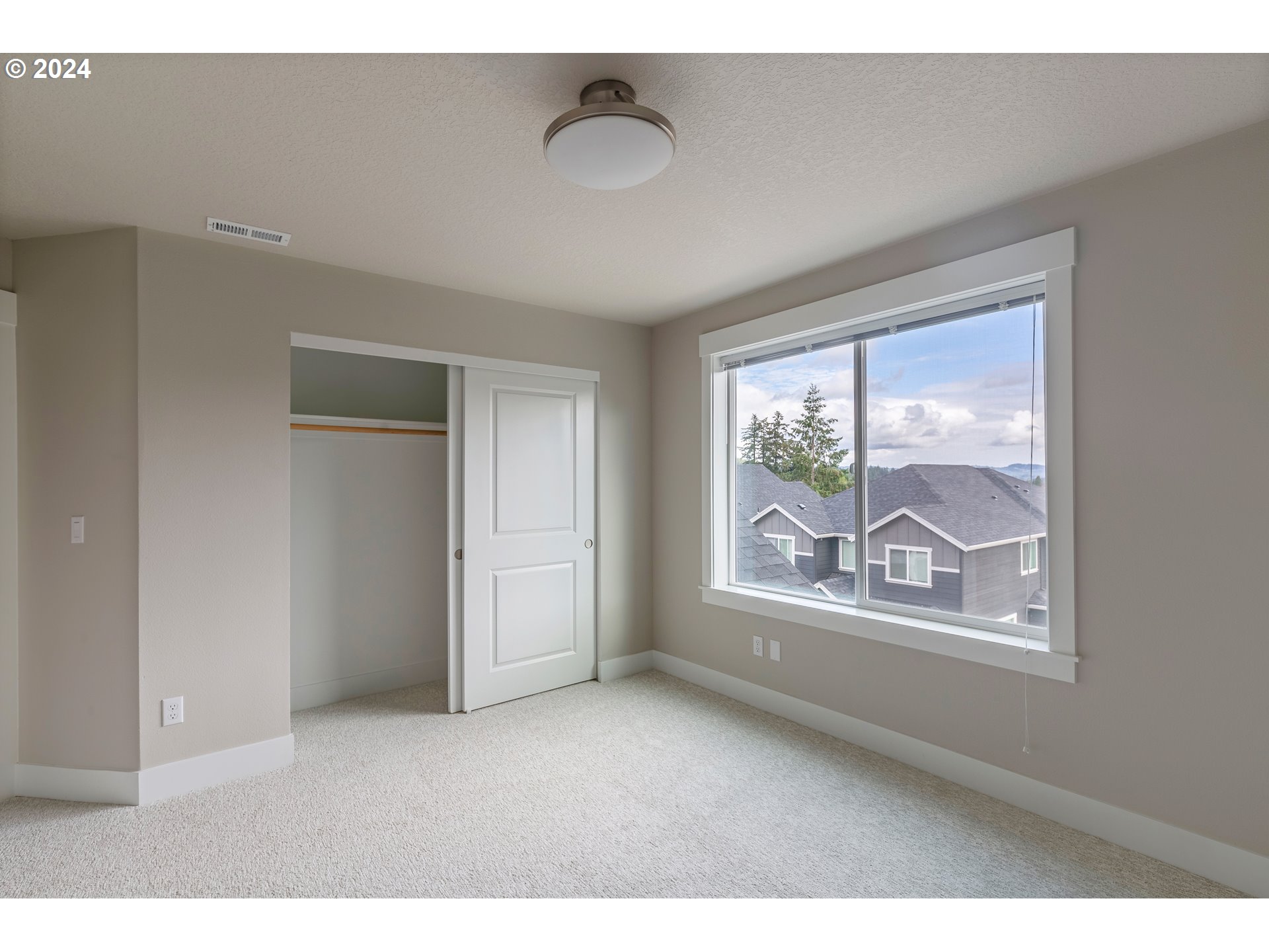17683 Southwest Cobb Lane Beaverton, OR 97007 - Photo 22 of 27 a view of an empty room with a window