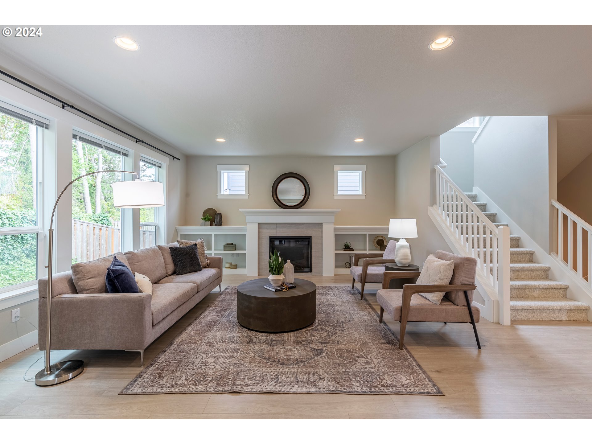 17683 Southwest Cobb Lane Beaverton, OR 97007 - Photo 3 of 27 a living room with fireplace furniture and a large window