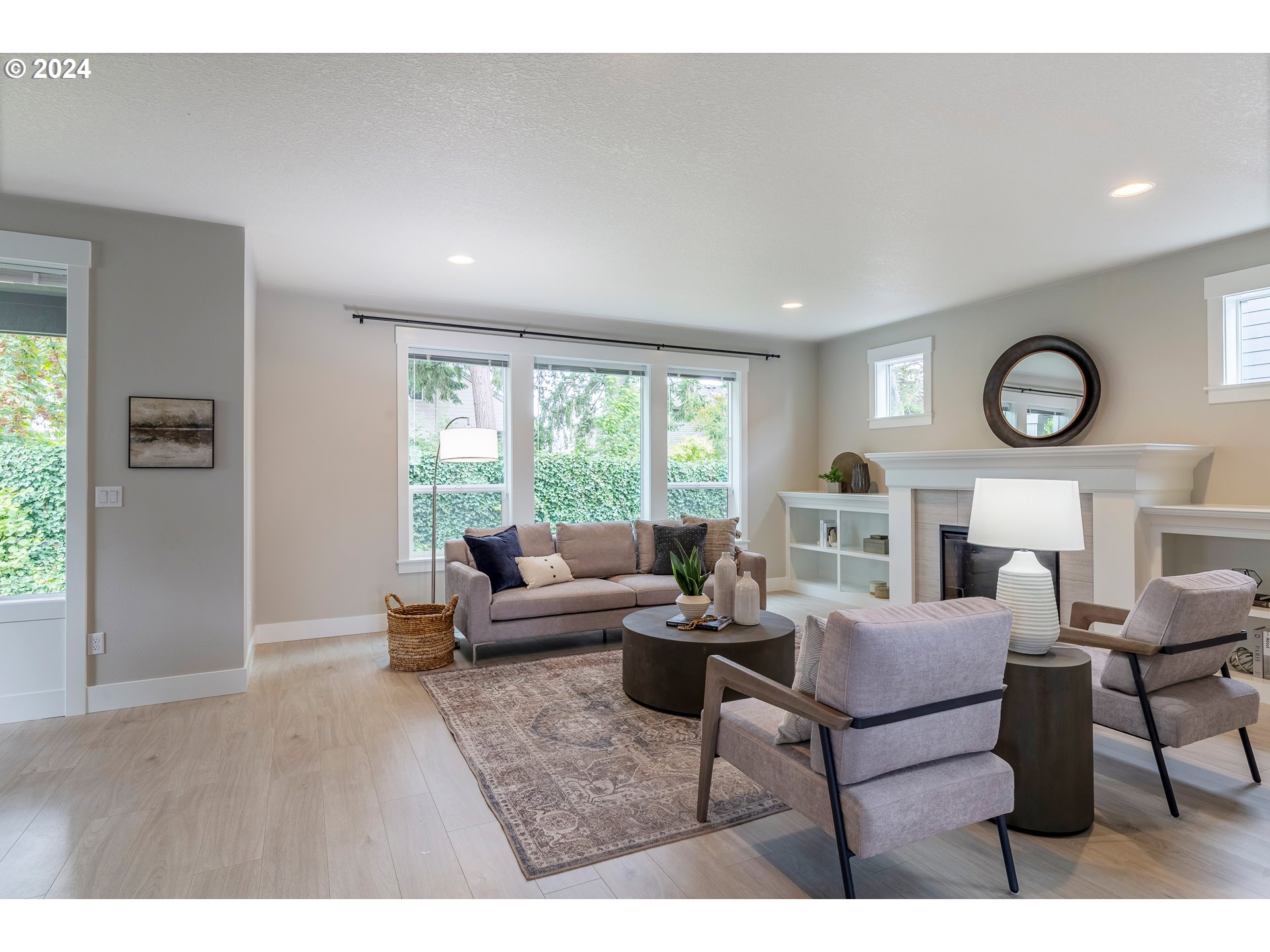 17683 Southwest Cobb Lane Beaverton, OR 97007 - Photo 4 of 27 a living room with furniture and a large window