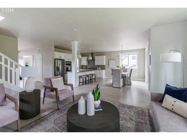 a living room with fireplace furniture and a wooden floor