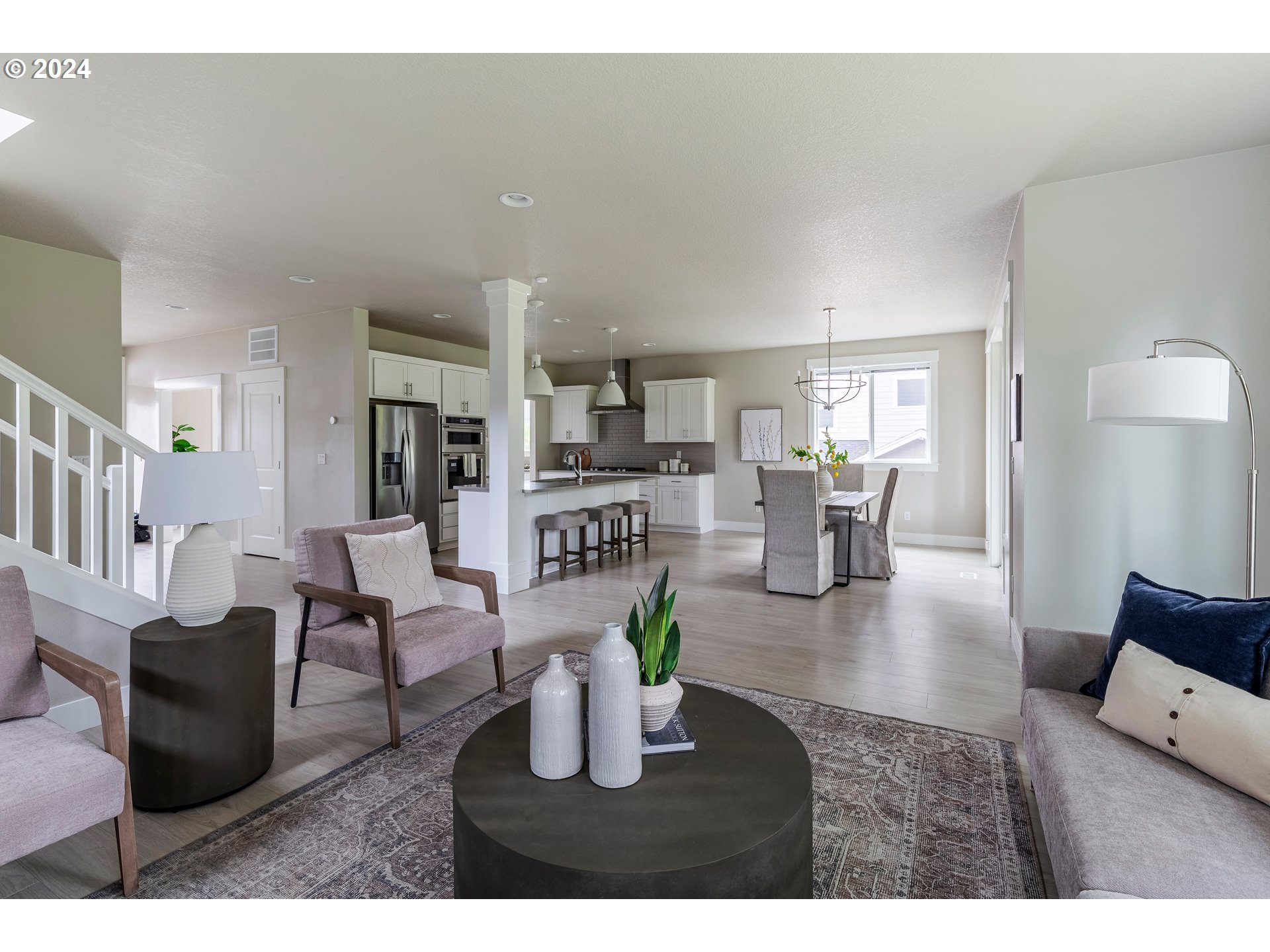 17683 Southwest Cobb Lane Beaverton, OR 97007 - Photo 5 of 27 a living room with fireplace furniture and a wooden floor