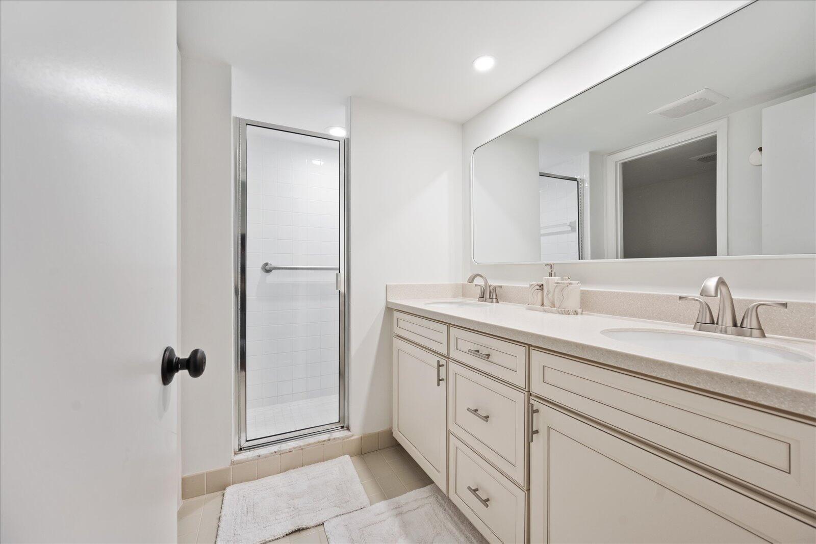 13307 Polo Club Road, Unit C106 Wellington, FL 33414 - Photo 17 of 25 a bathroom with a double vanity sink