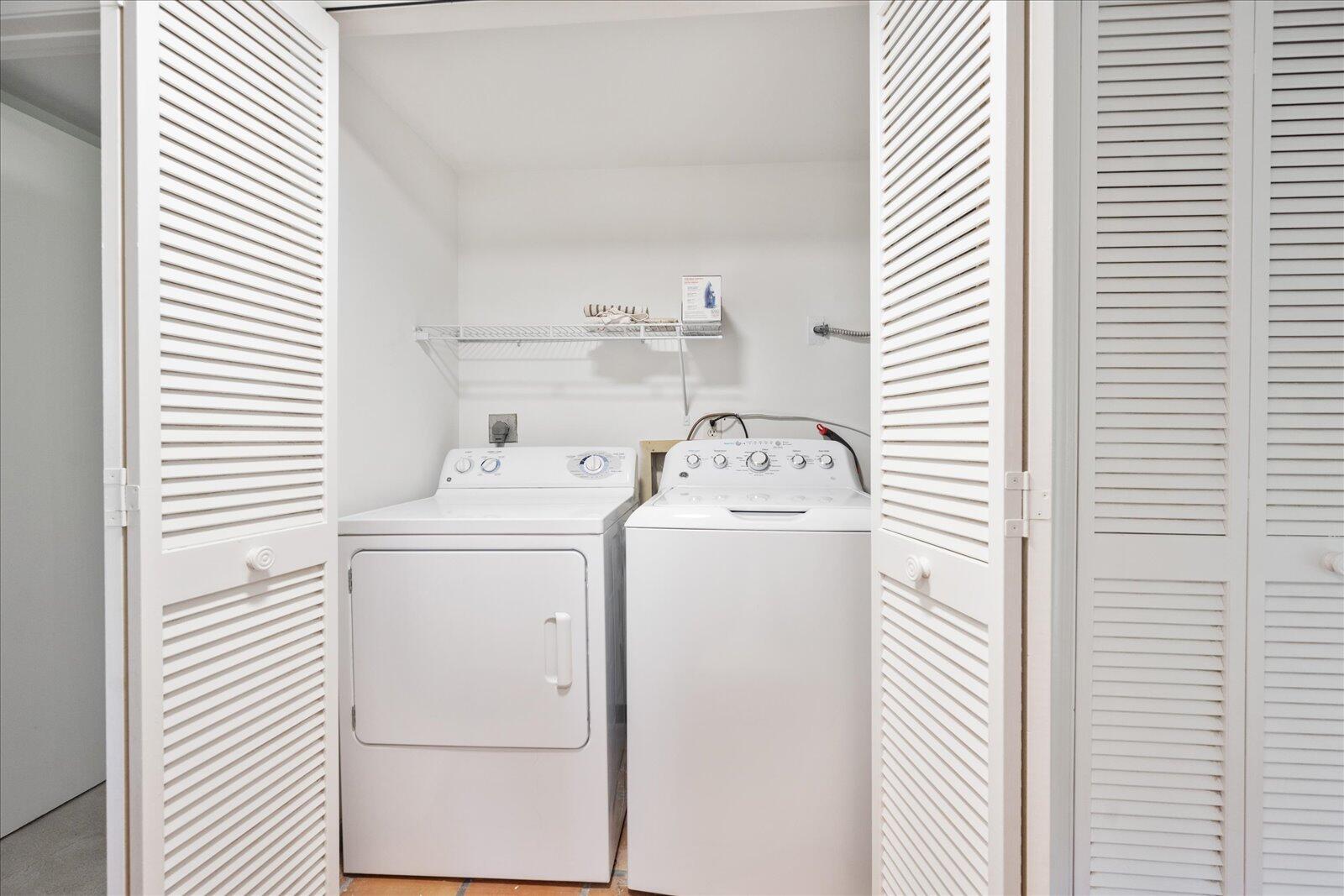 13307 Polo Club Road, Unit C106 Wellington, FL 33414 - Photo 23 of 25 a utility room with dryer and washer
