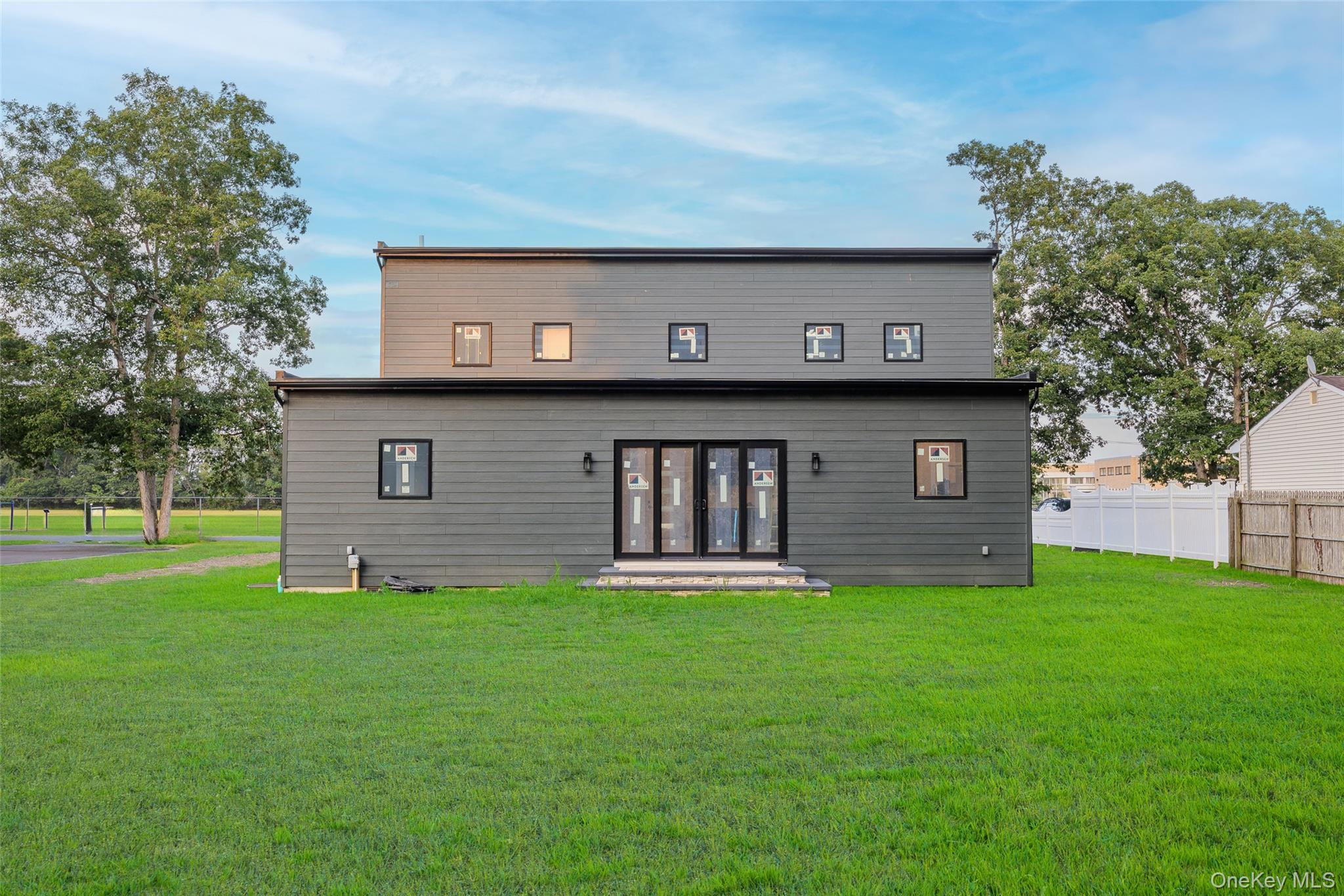 26 Tremont Avenue Patchogue, NY 11772 - Photo 11 of 50 a view of a house with a back yard