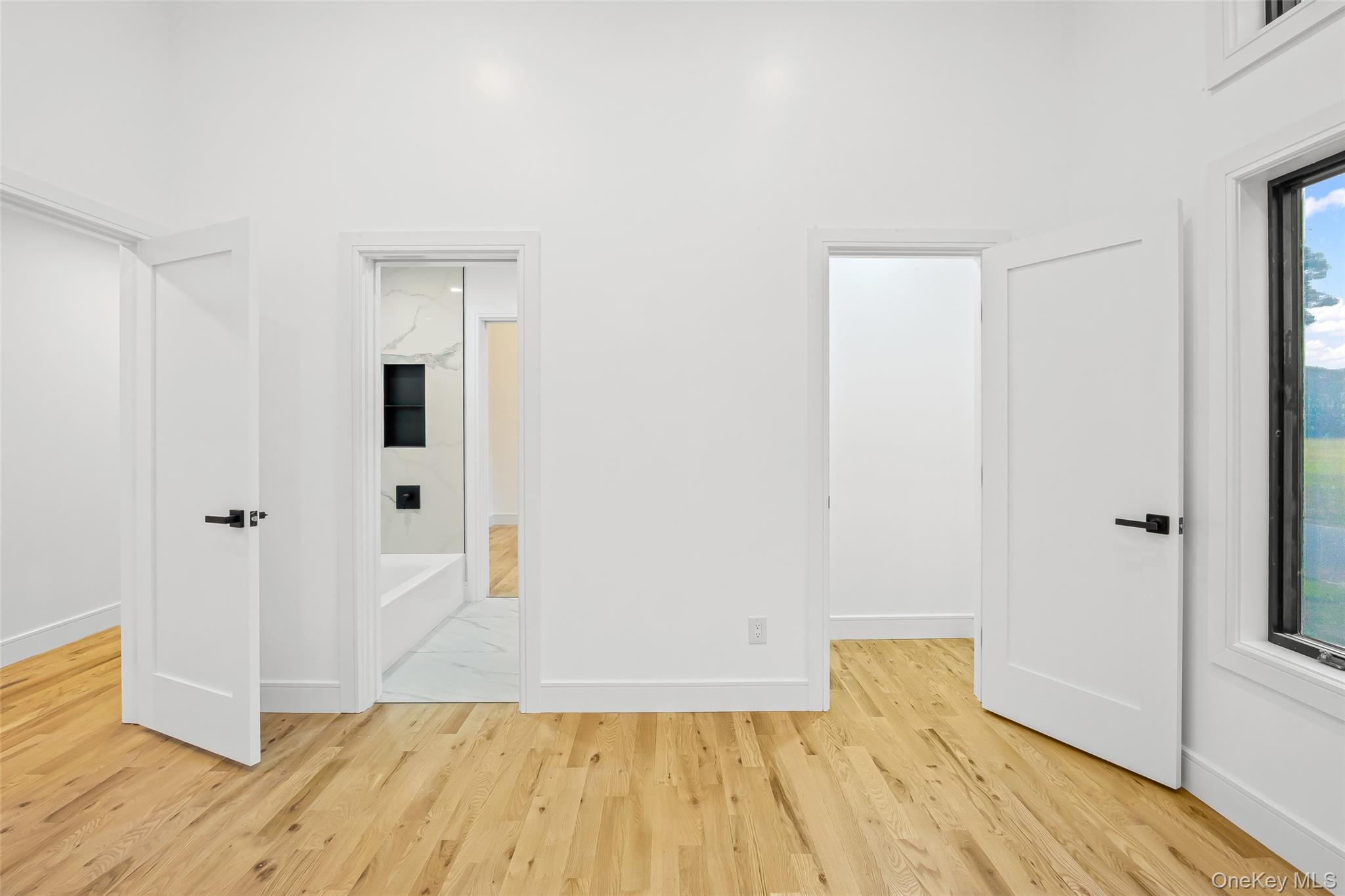 26 Tremont Avenue Patchogue, NY 11772 - Photo 16 of 50 a view of empty room with wooden floor
