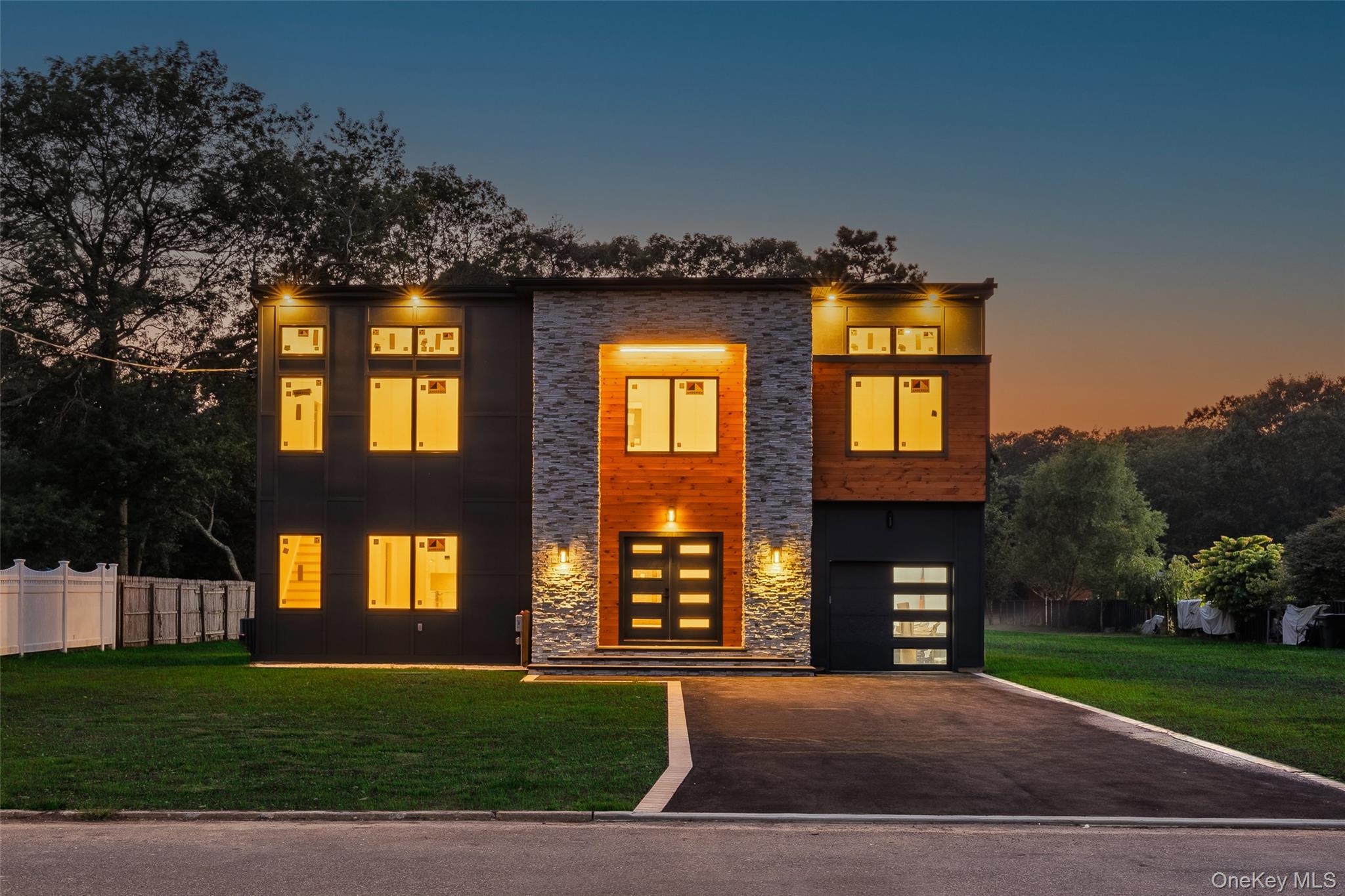 26 Tremont Avenue Patchogue, NY 11772 - Photo 2 of 50 a front view of a house with a yard