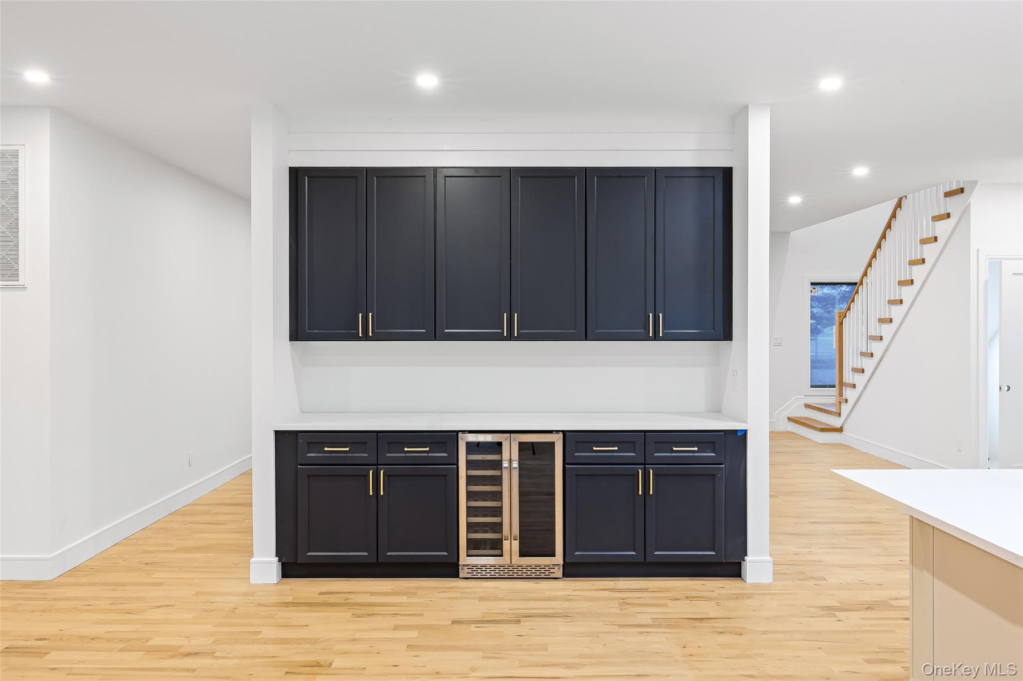 26 Tremont Avenue Patchogue, NY 11772 - Photo 36 of 50 a kitchen with a cabinets and a sink