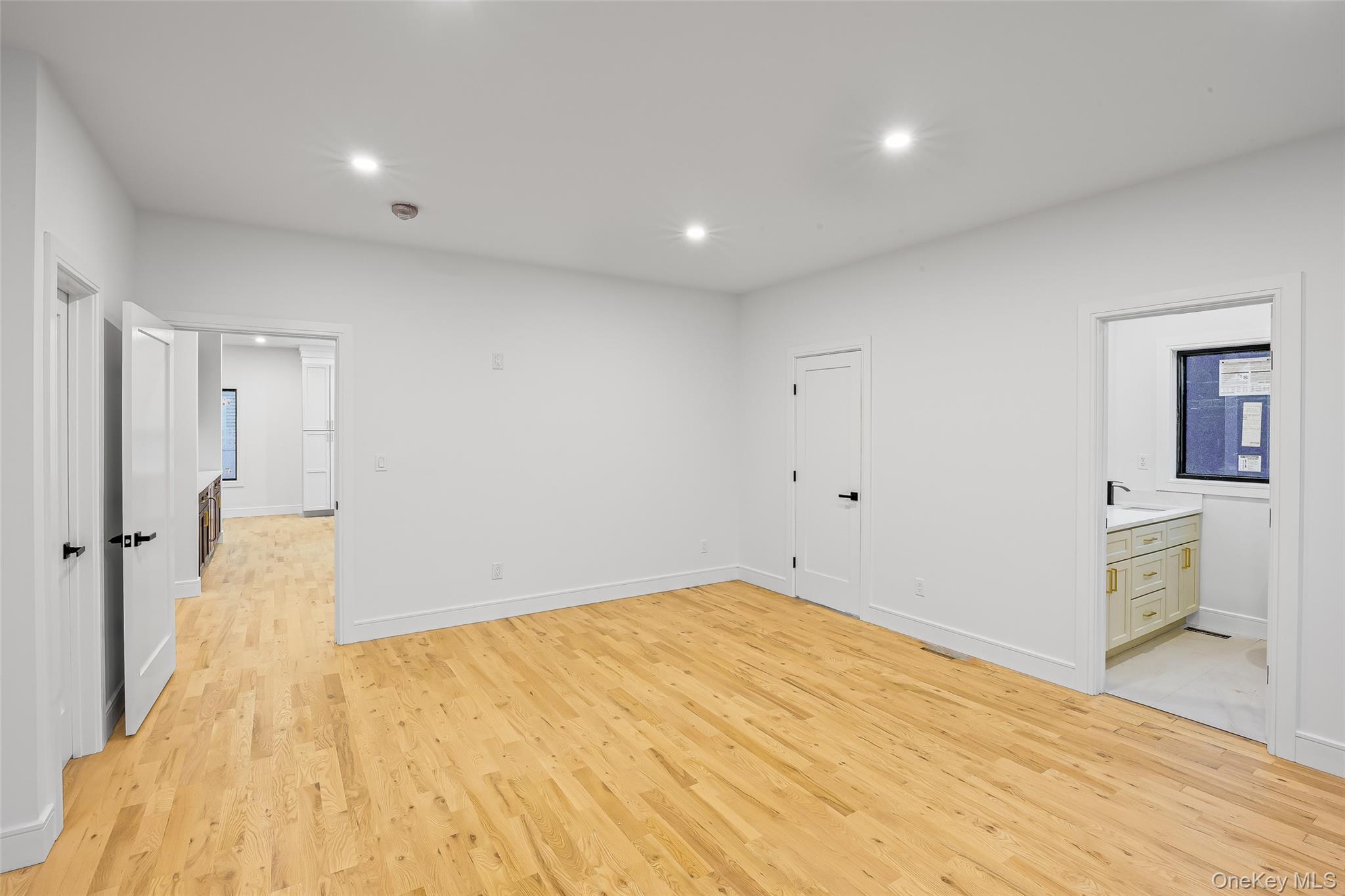 26 Tremont Avenue Patchogue, NY 11772 - Photo 40 of 50 a big room with wooden floor and bathroom