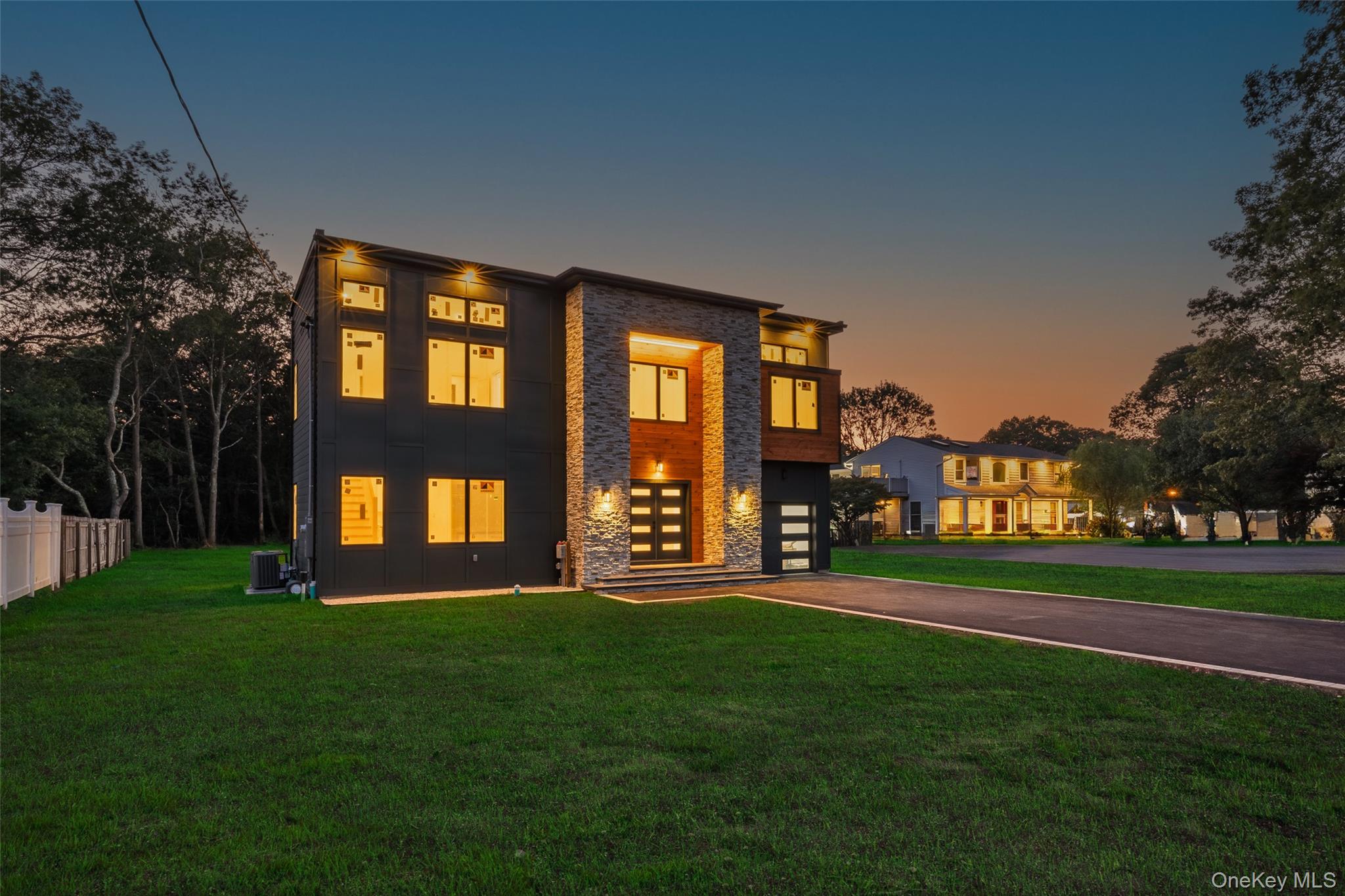 26 Tremont Avenue Patchogue, NY 11772 - Photo 4 of 50 a front view of a house with a yard