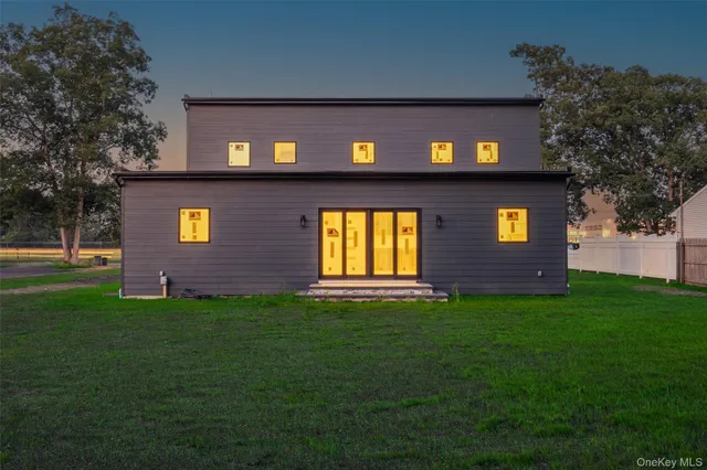 a view of a brick house with a yard