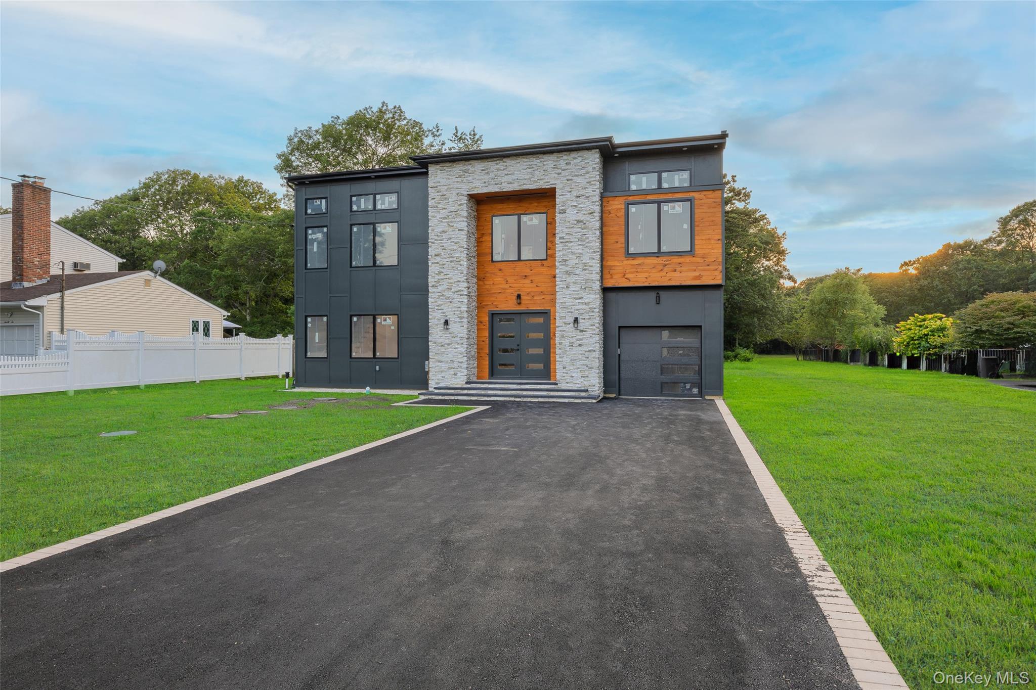 26 Tremont Avenue Patchogue, NY 11772 - Photo 8 of 50 a view of a house with a yard