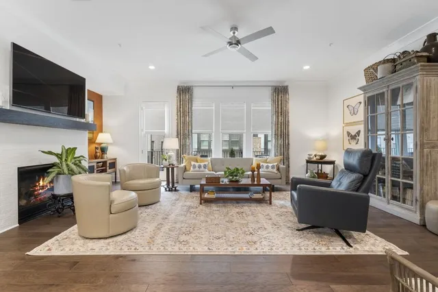 a living room with fireplace furniture and a flat screen tv