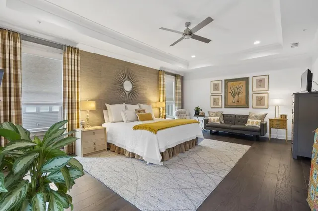 a bathroom with a double vanity sink a mirror and a bathtub