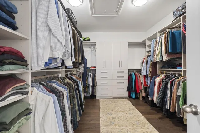 a bedroom with a large bed and a large window
