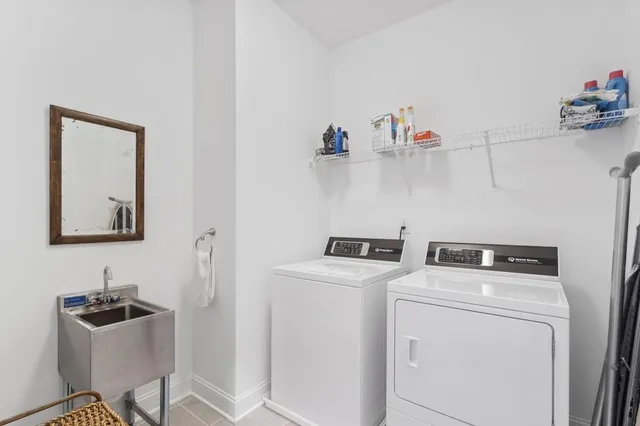 a bathroom with a granite countertop sink a toilet and shower
