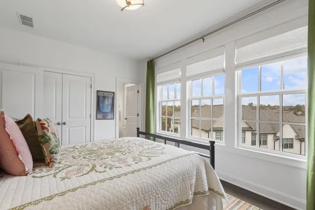 a living room filled with furniture and a book shelf