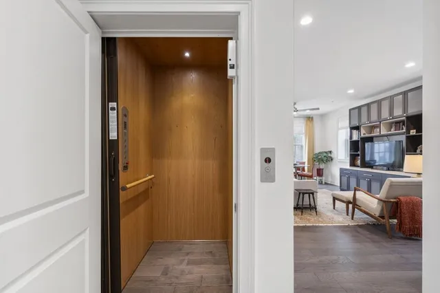 a living room with furniture fireplace and flat screen tv