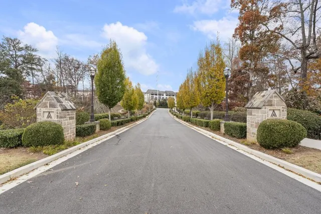 a front view of a residential apartment building with a yard