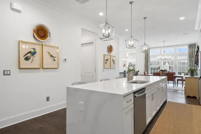 a large kitchen with a table and chairs