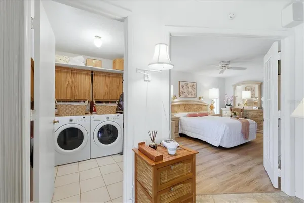 a bedroom with furniture and a wooden floor
