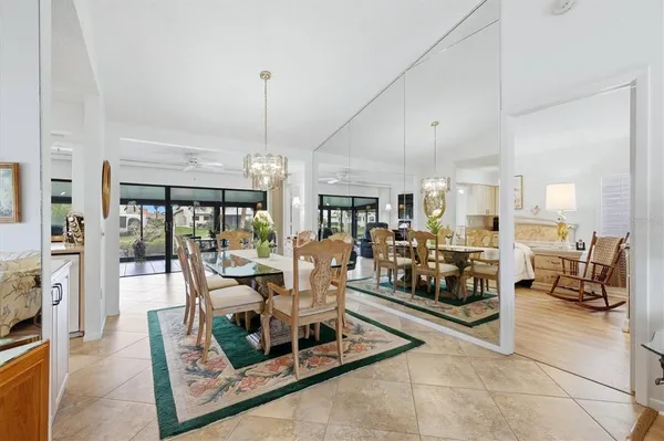 a living room with lots of furniture and a chandelier