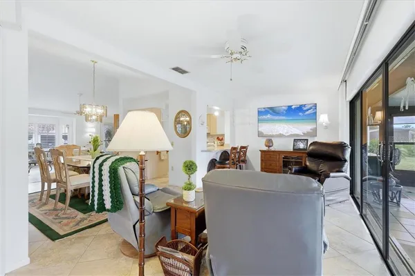 a view of a livingroom with furniture and a window