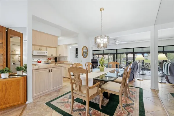 a very nice looking dining room with a table and chairs